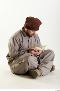 Luis Donovan Afgan Reading Book reading sitting whole body 0001.jpg